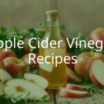 A glass bottle of apple cider vinegar with fresh apples and herbs, rustic wooden table, natural light, appetizing and fresh vibe.