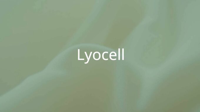 Close-up of soft, shimmering lyocell fabric, natural wood pulp fibers visible, eco-friendly textile, smooth and lightweight texture, neutral tones, realistic.