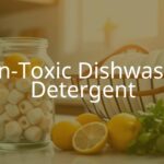 A modern kitchen scene with a glass jar of non-toxic dishwasher detergent pods, fresh lemons and herbs nearby, clean dishes in a wood drying rack, natural sunlight, bright and fresh vibe.